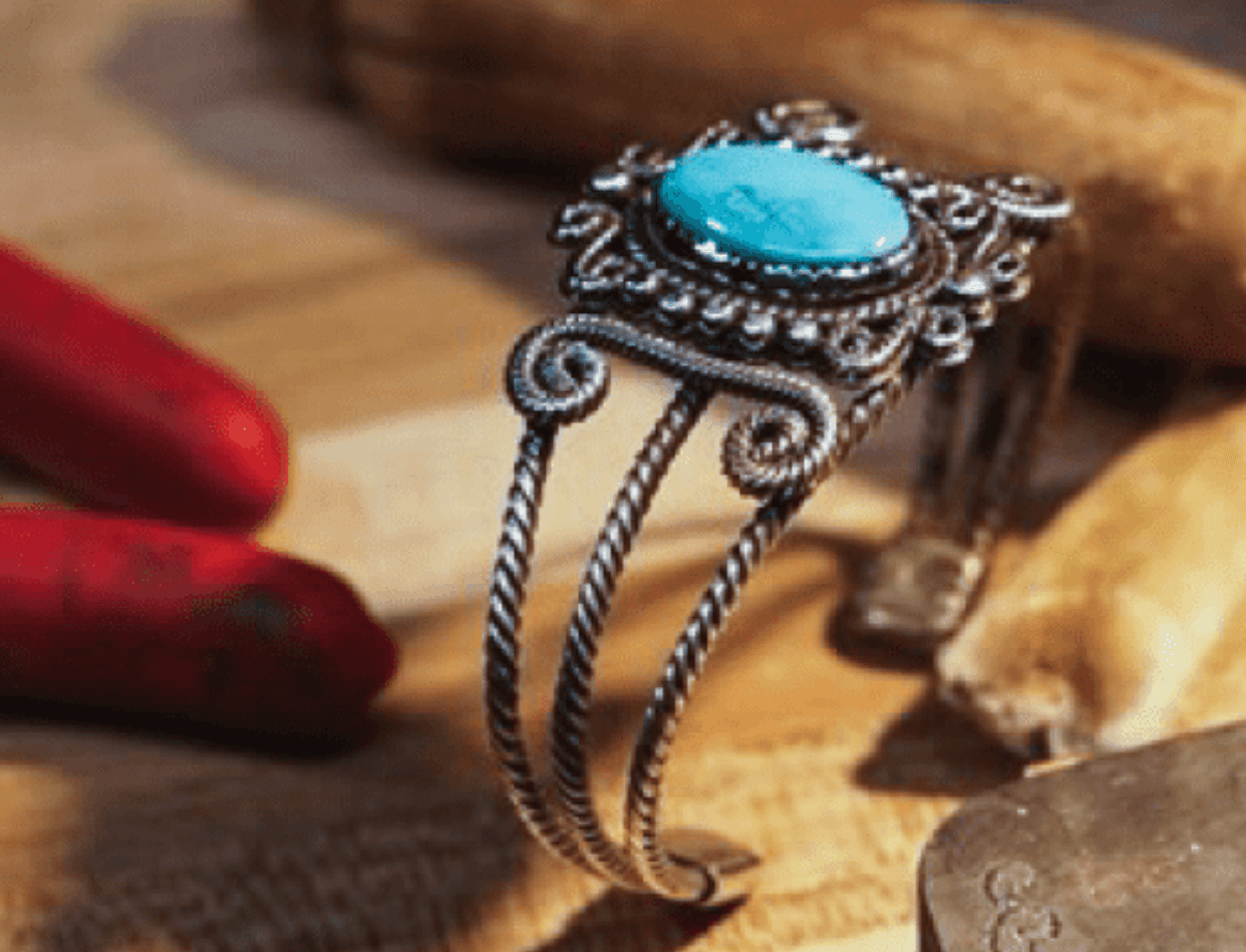 Handmade silver filigree cuff bracelet with a turquoise oval and twisted rope bands