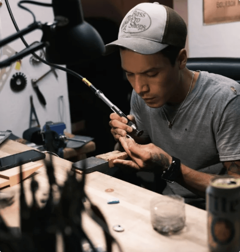 Christopher Bazan at his Salt Lake City bench, working on a handmade silver piece